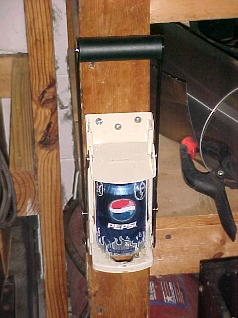 the first can crusher mounted in the garge to the workbench