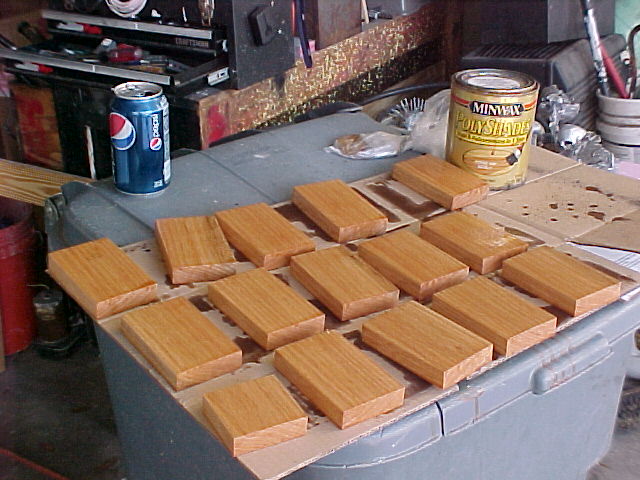 the Oak bases are twice coated with stain and a polyurethane sealant...makes them glossy