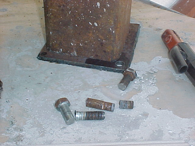 3/8" bolts cut down to become the lifting lugs on the crucibles